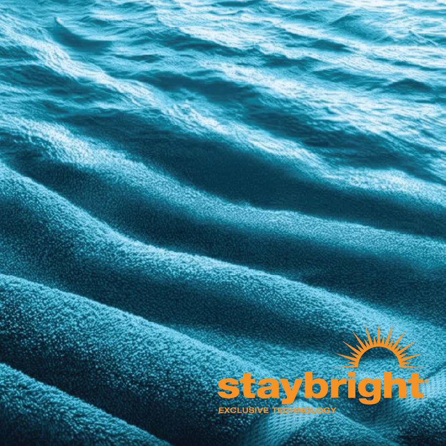 Close-up of textured blue fabric with 'staybright' logo